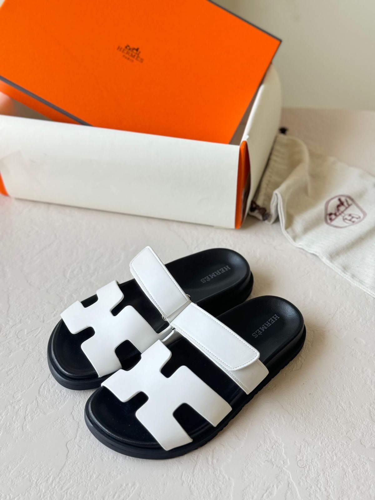 Hermès Chypre Sandals – White & Black Sole